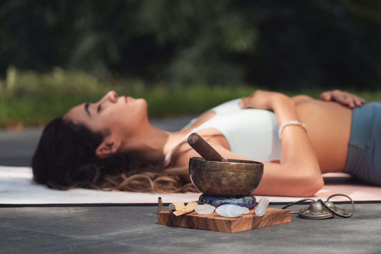 Woman Lying on Blue Yoga Mat