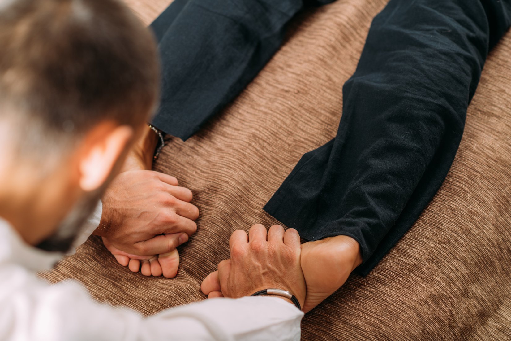 Shiatsu Foot Massage. Therapist Massaging the Kidney Meridian